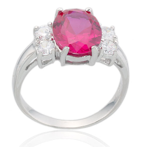 Oval Ruby and Four CZ Ring